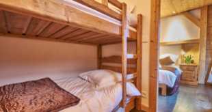 Adjoining bunk room in family room at Chalet Virolet
