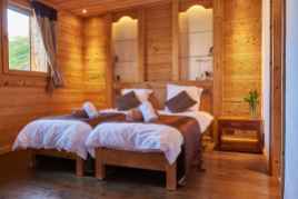 Twin beds in a family room at Chalet Virolet